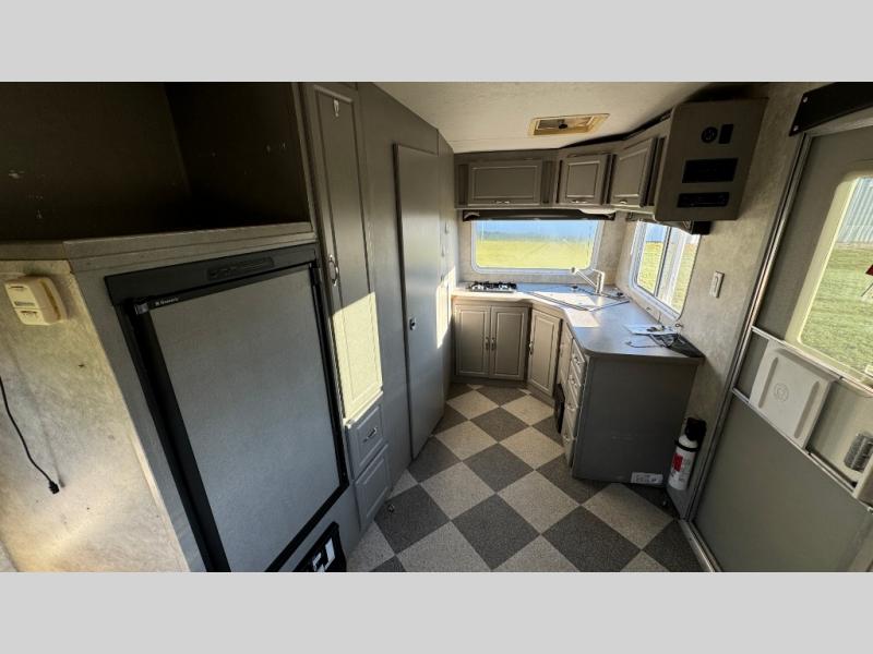 Used 2008 Weekend Warrior SUPER CROSS SXFK1800 toy hauler travel trailer interior view with the front kitchen and private bathroom